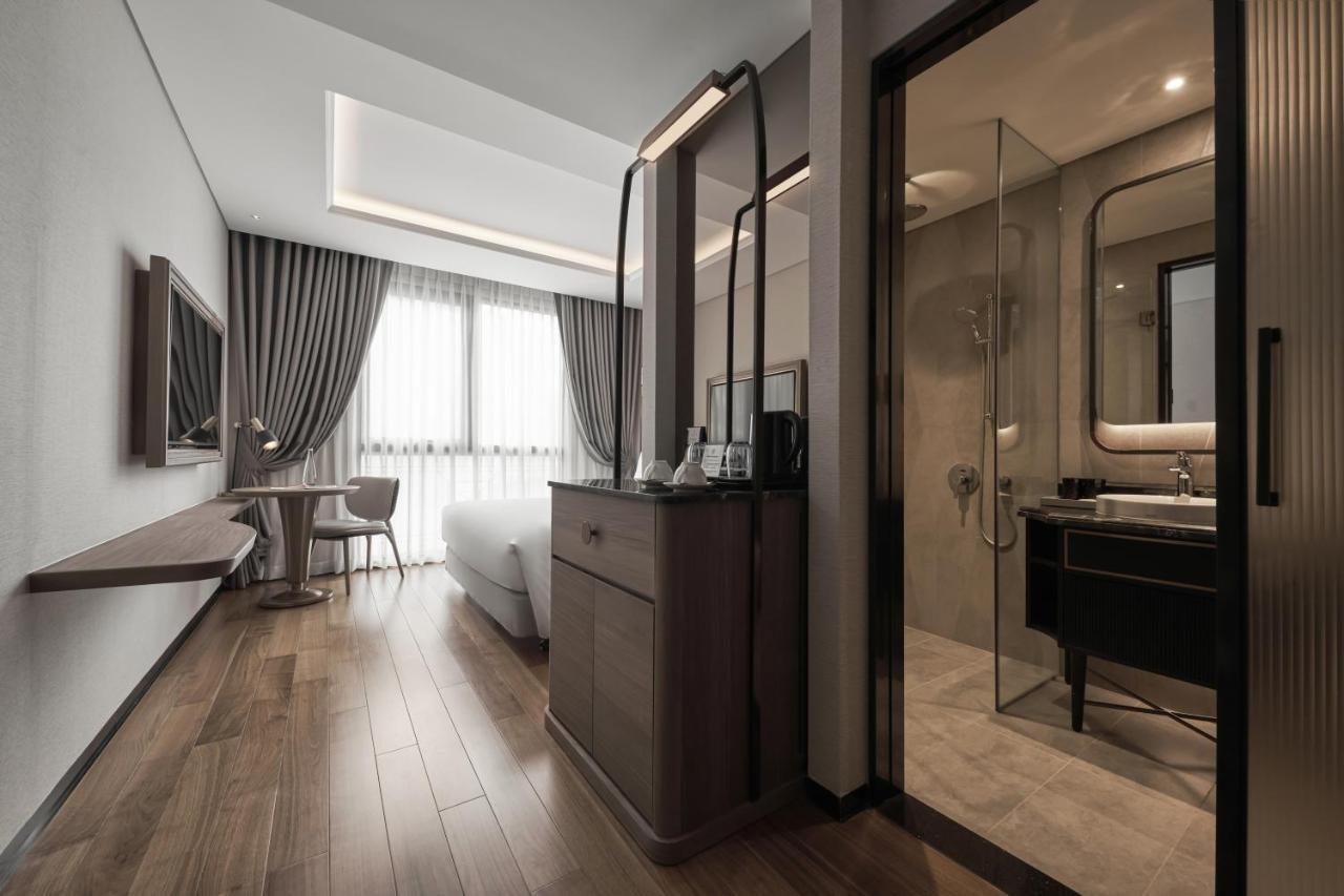 מלון הו צ'י מין סיטי La Siesta Premium Saigon מראה חיצוני תמונה A room at the hotel